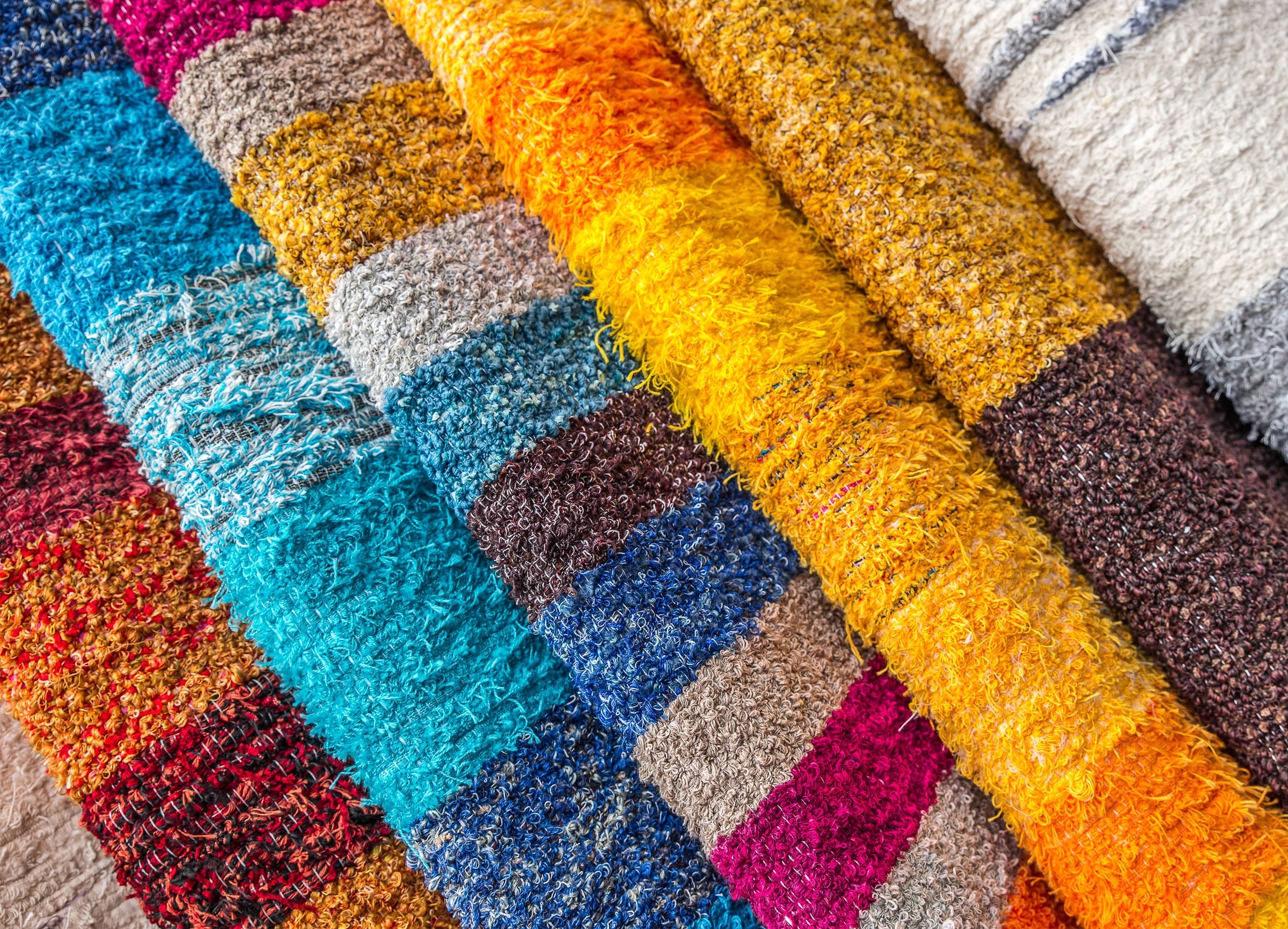 Folded, colourful textiles